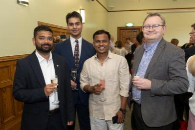 four men smiling for picture